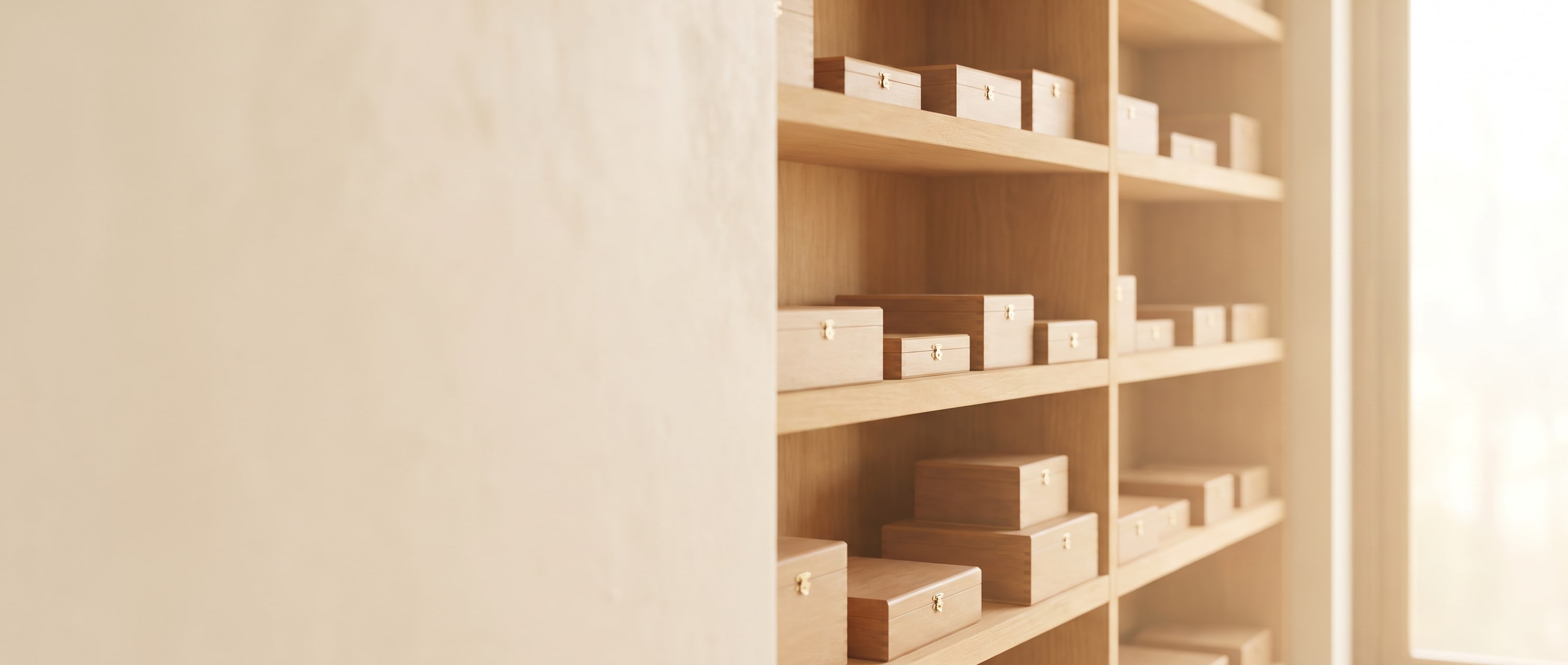 A bright private humidor with cedar shelves of cigar boxes in daylight